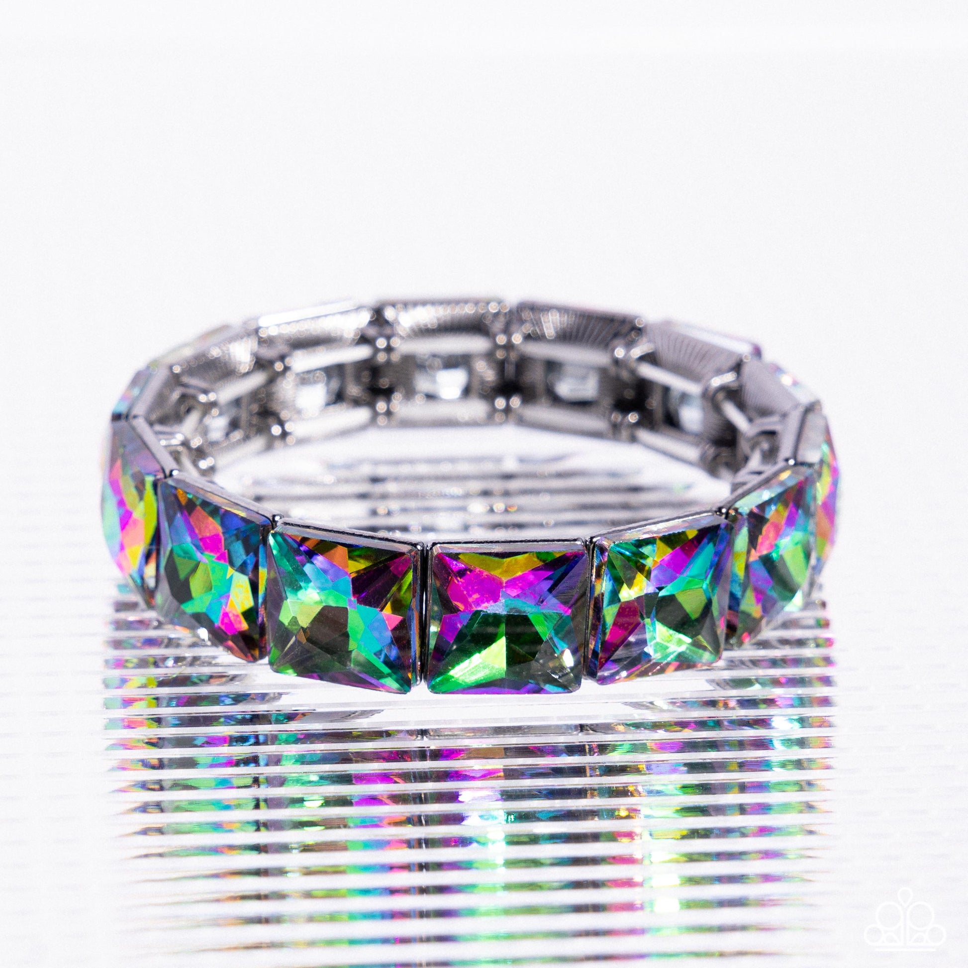 Silver bracelet with colorful gemstones on a white background