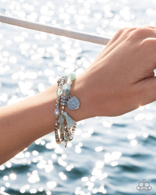 Bracelet on wrist with water background