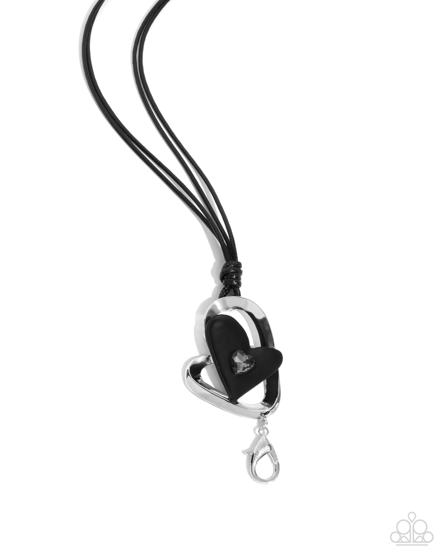 Black heart-shaped pendant on a black cord against a white background