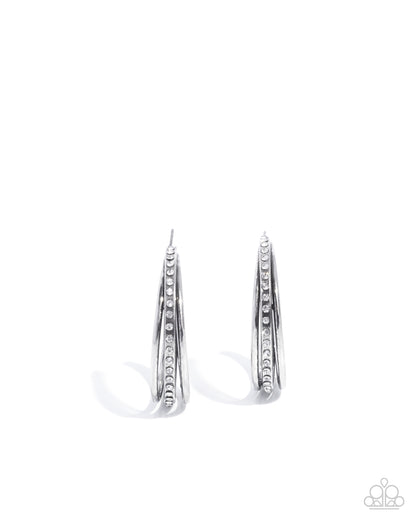 Pair of silver hoop earrings on a white background