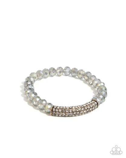 Silver beaded bracelet with a rose gold accent on a white background