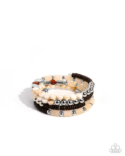 Set of beaded bracelets on a white background