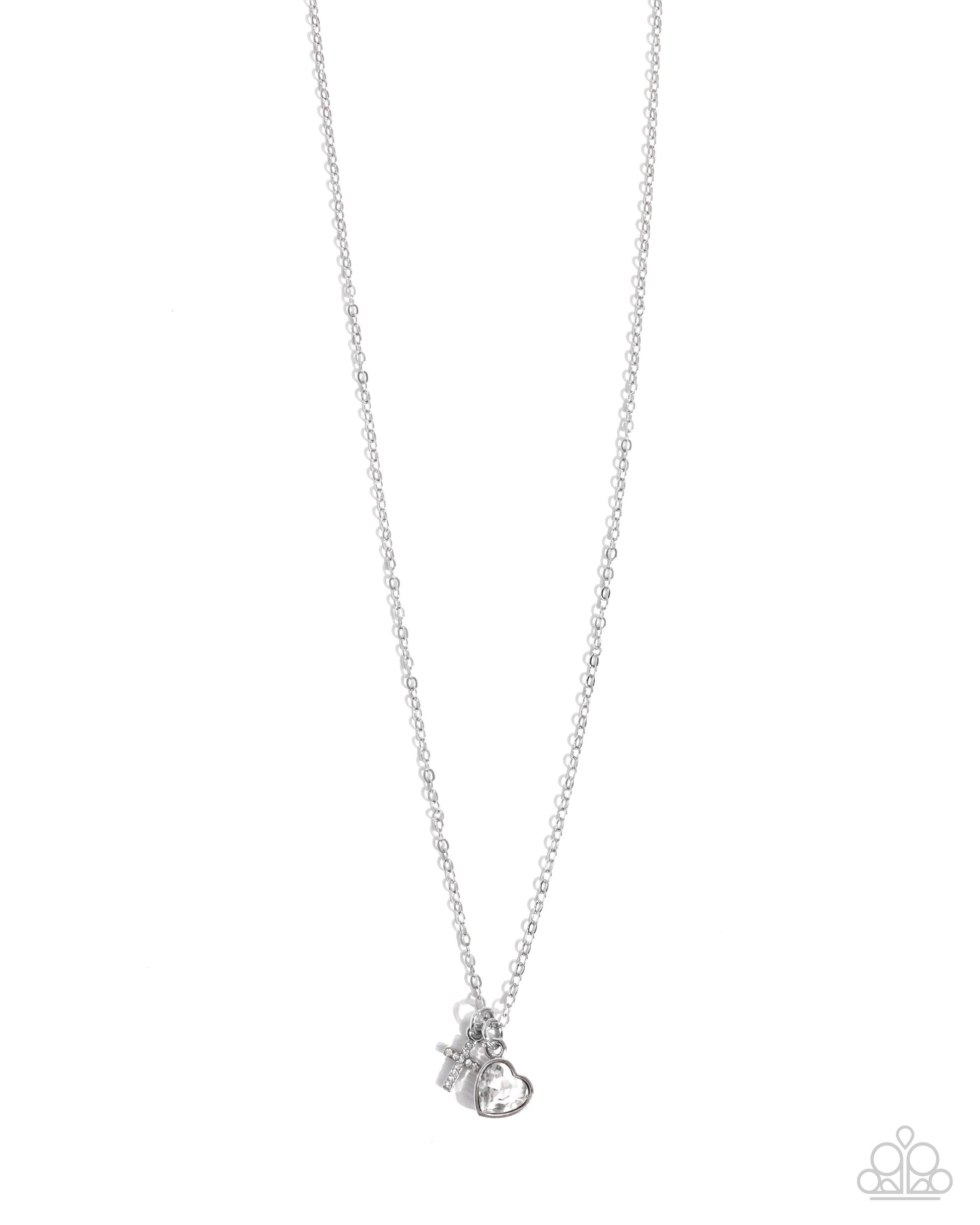 Silver necklace with a small pendant on a white background