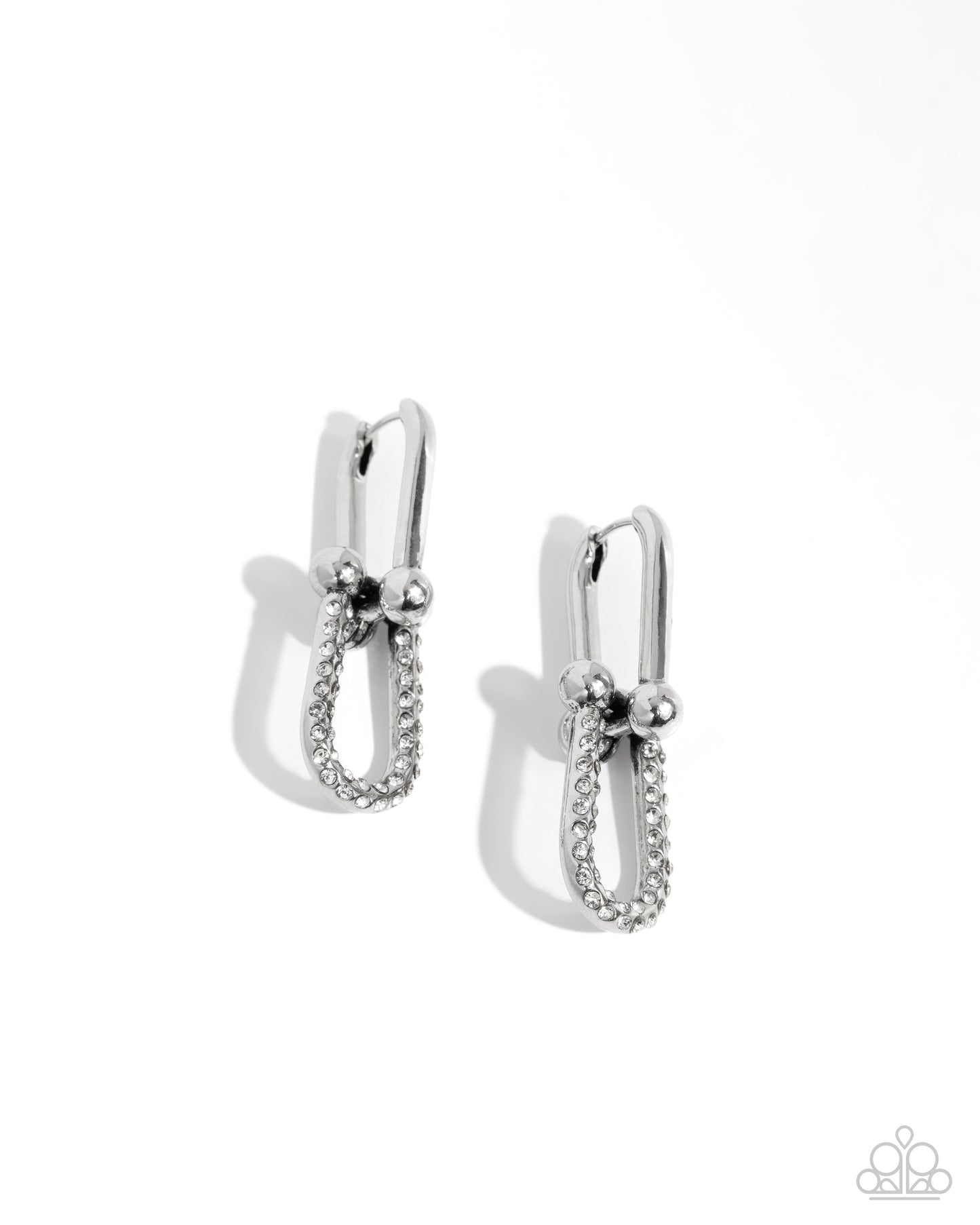 A pair of silver-toned hoop earrings with a textured pavé band and small bead details, shown on a clean white background with soft shadows.