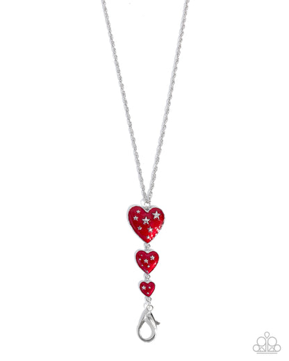 Necklace with red heart-shaped pendants on a white background