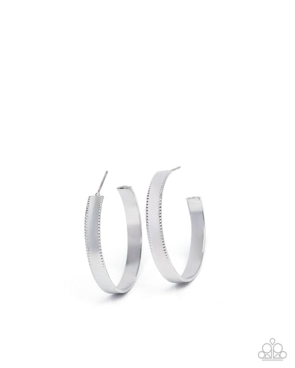 Silver hoop earrings on a white background