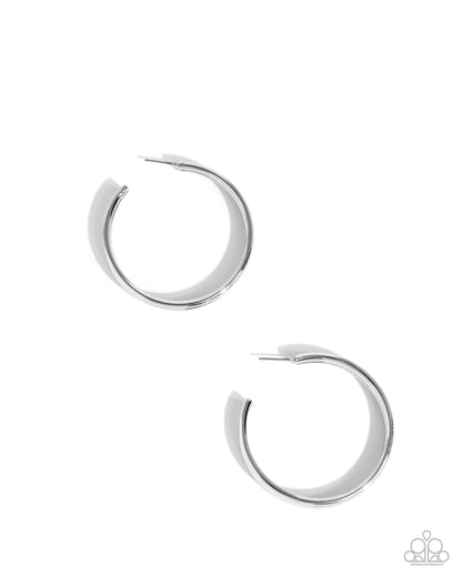 Pair of silver hoop earrings on a white background