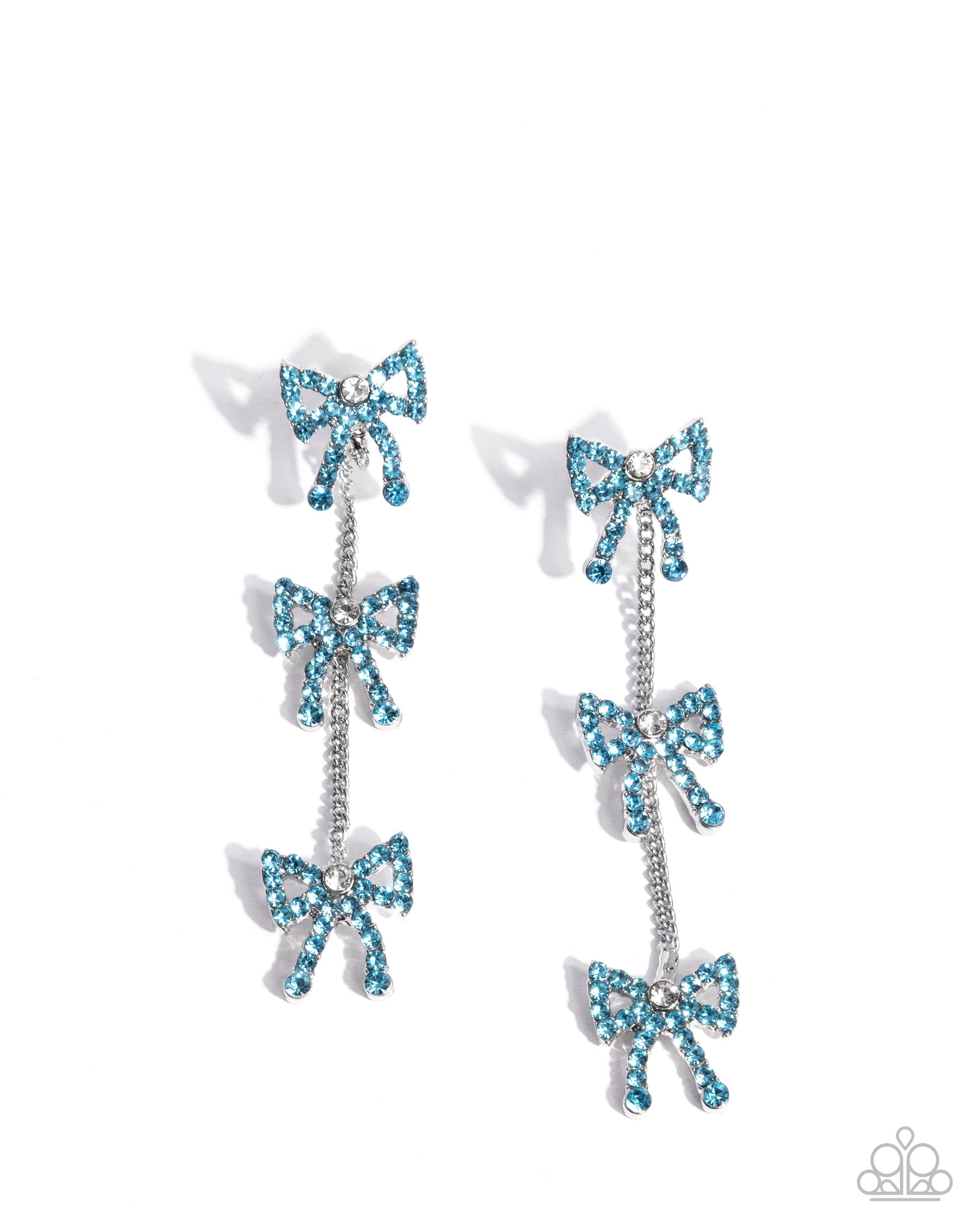 Pair of earrings with blue bow designs on a white background