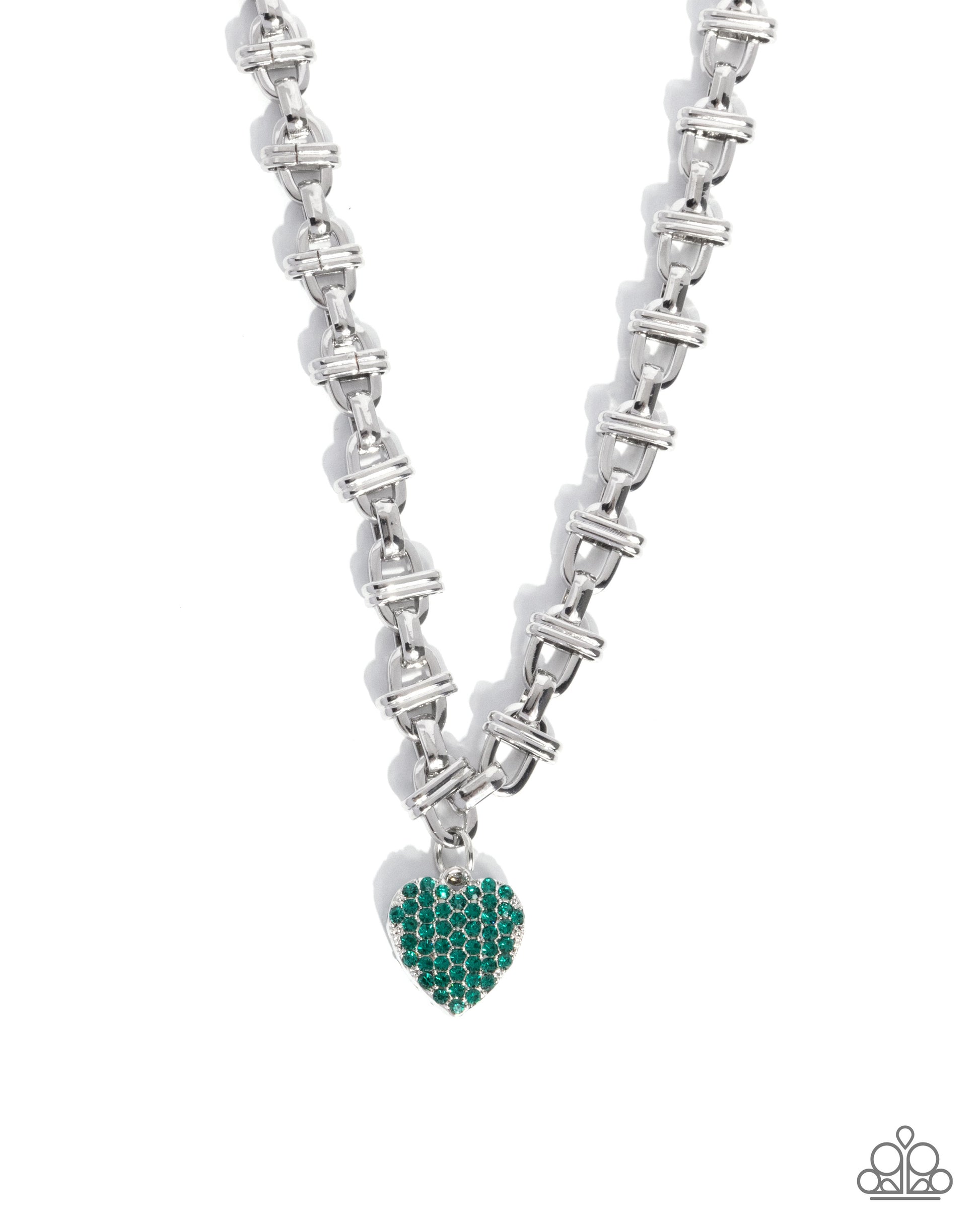 A silver-tone chain necklace with a heart-shaped pendant encrusted with green gemstones, shown on a plain white background.