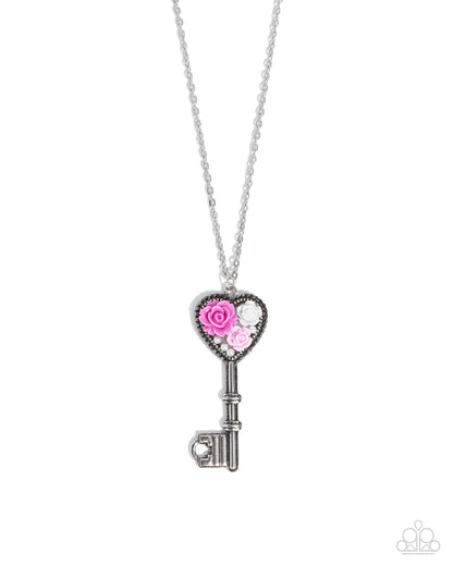 Silver key-shaped pendant with pink rose design on a white background