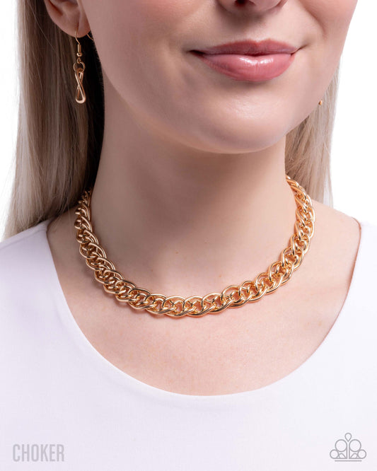 Rose gold chain choker worn by a model on a white background