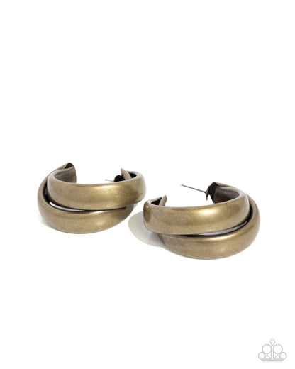 Pair of gold hoop earrings on a white background