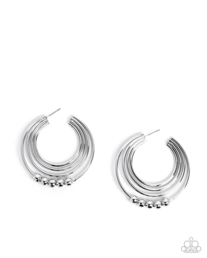 Silver hoop earrings with small beads on a white background