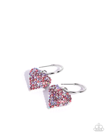 Heart-shaped earrings with colorful gemstones on a white background