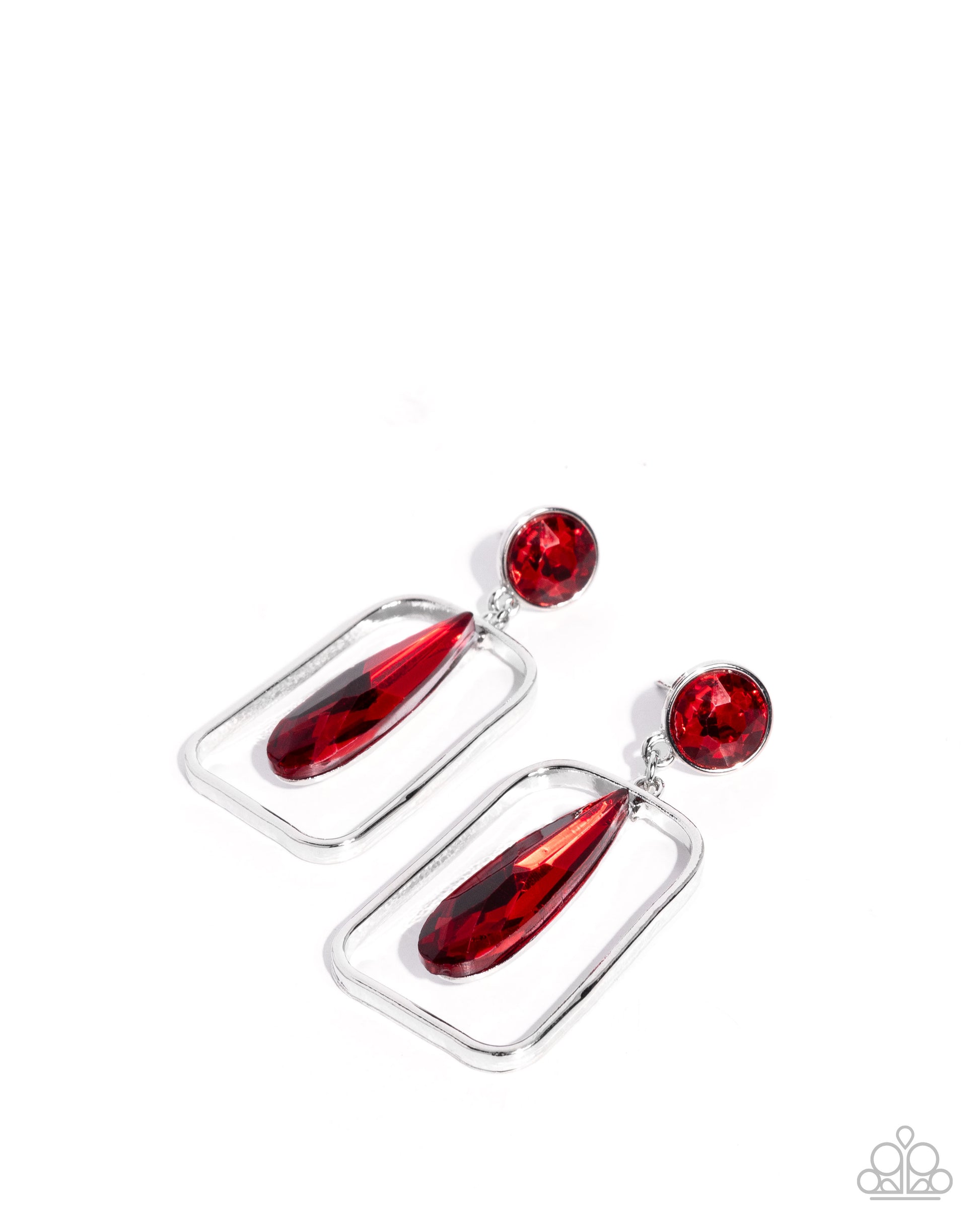 Pair of silver earrings with red teardrop-shaped stones on a white background