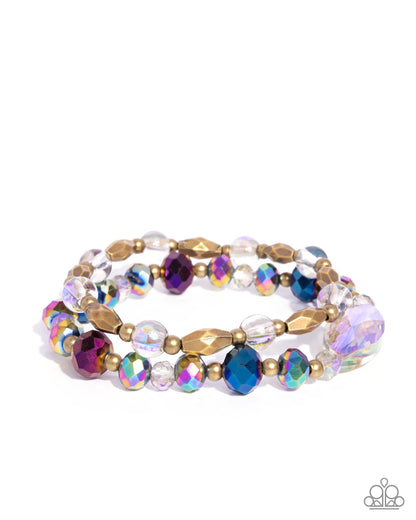 Multicolored beaded bracelet with gold accents on a white background