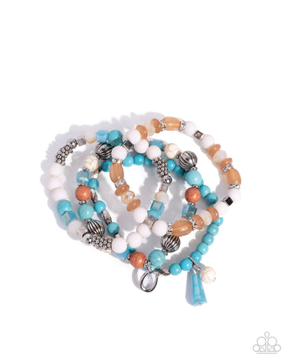 Set of beaded bracelets with blue, orange, and white beads on a white background