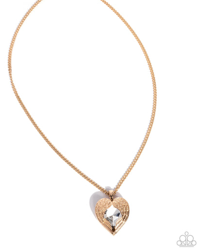Rose gold necklace with a heart-shaped pendant on a white background