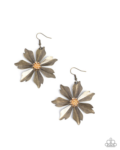Pair of bronze flower-shaped earrings with gold centers on a white background