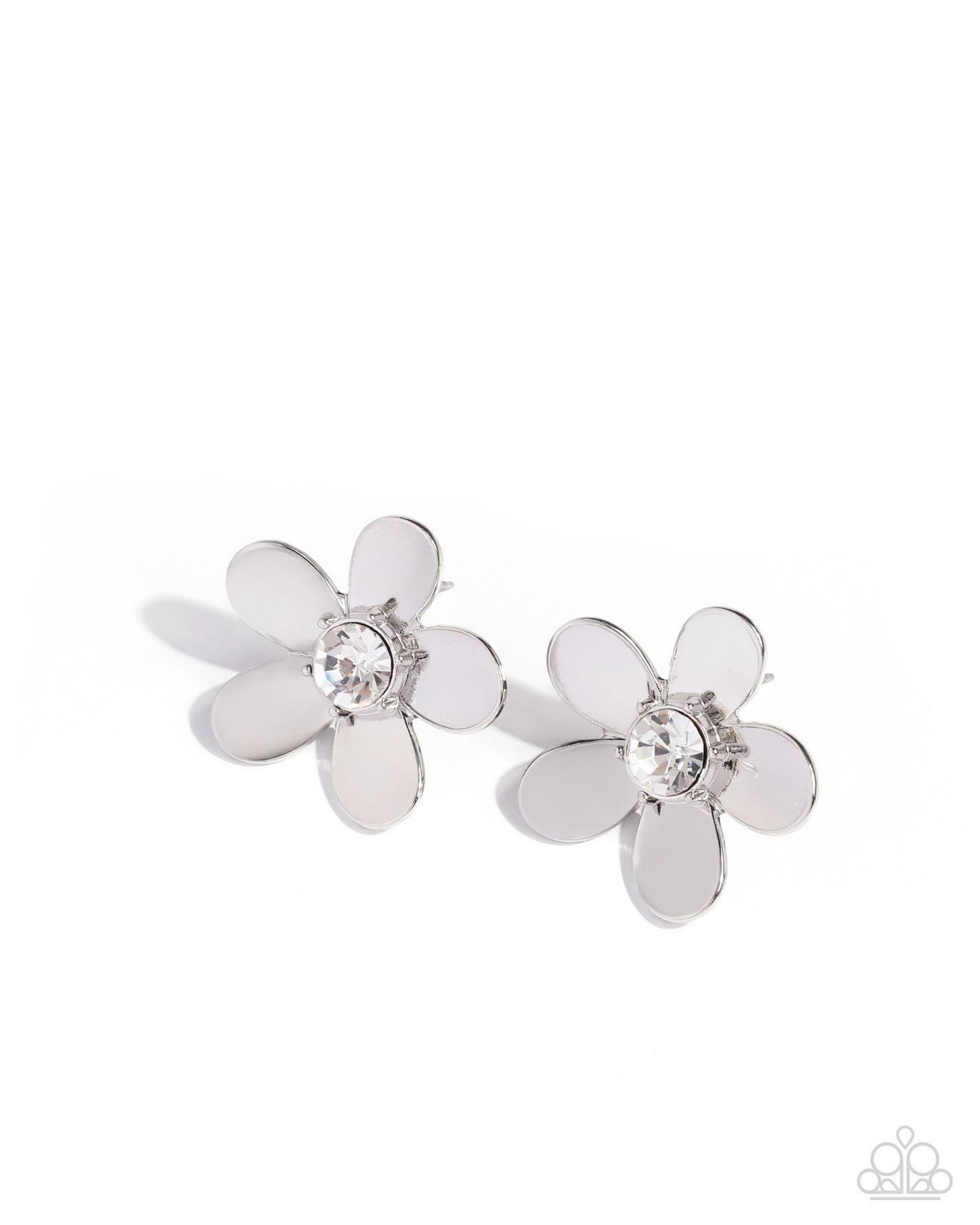 Pair of silver flower-shaped earrings with a central gemstone on a white background