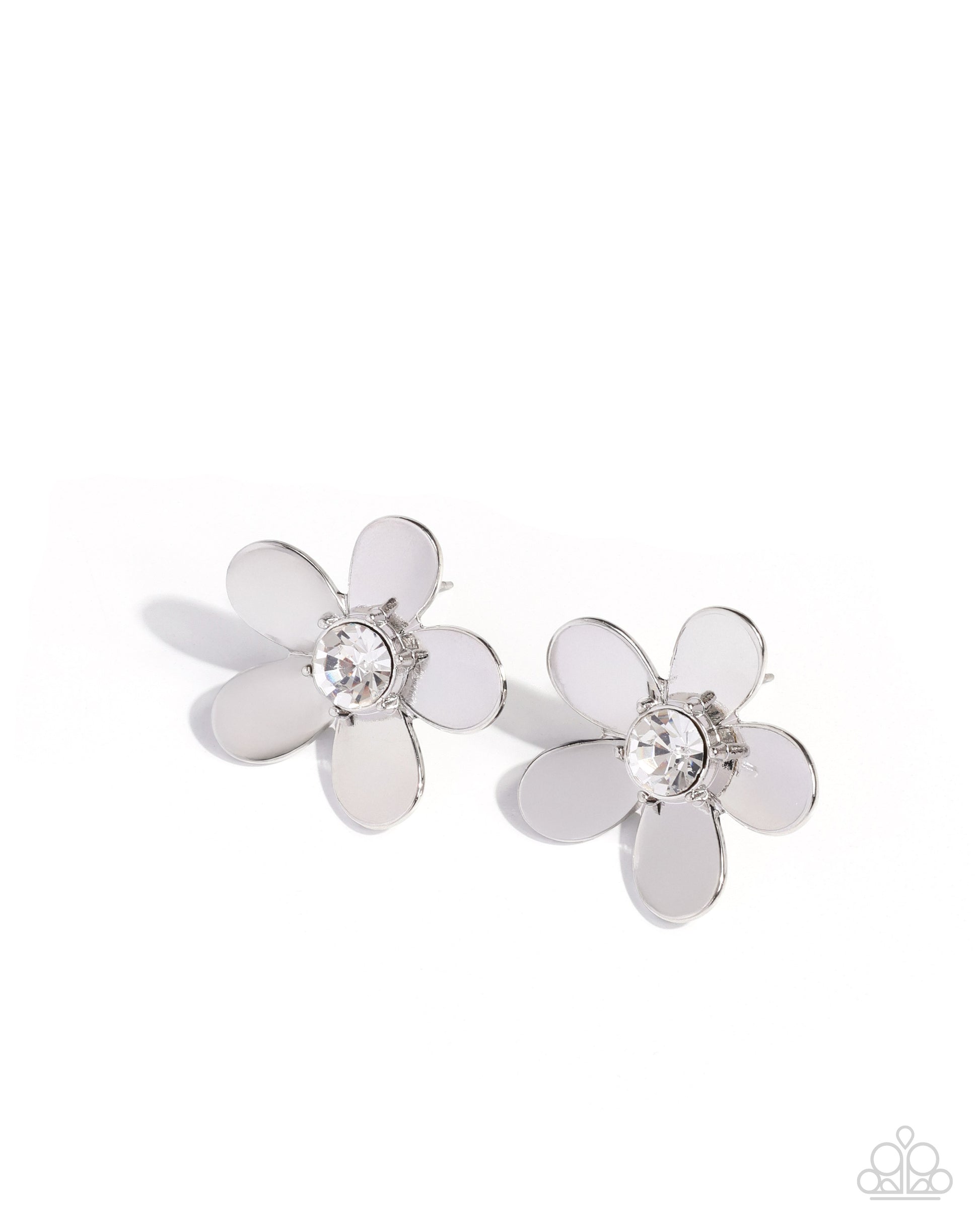 Pair of silver flower-shaped earrings with a central gemstone on a white background