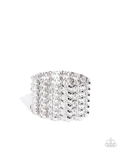 Silver bracelet with clear stones on a white background