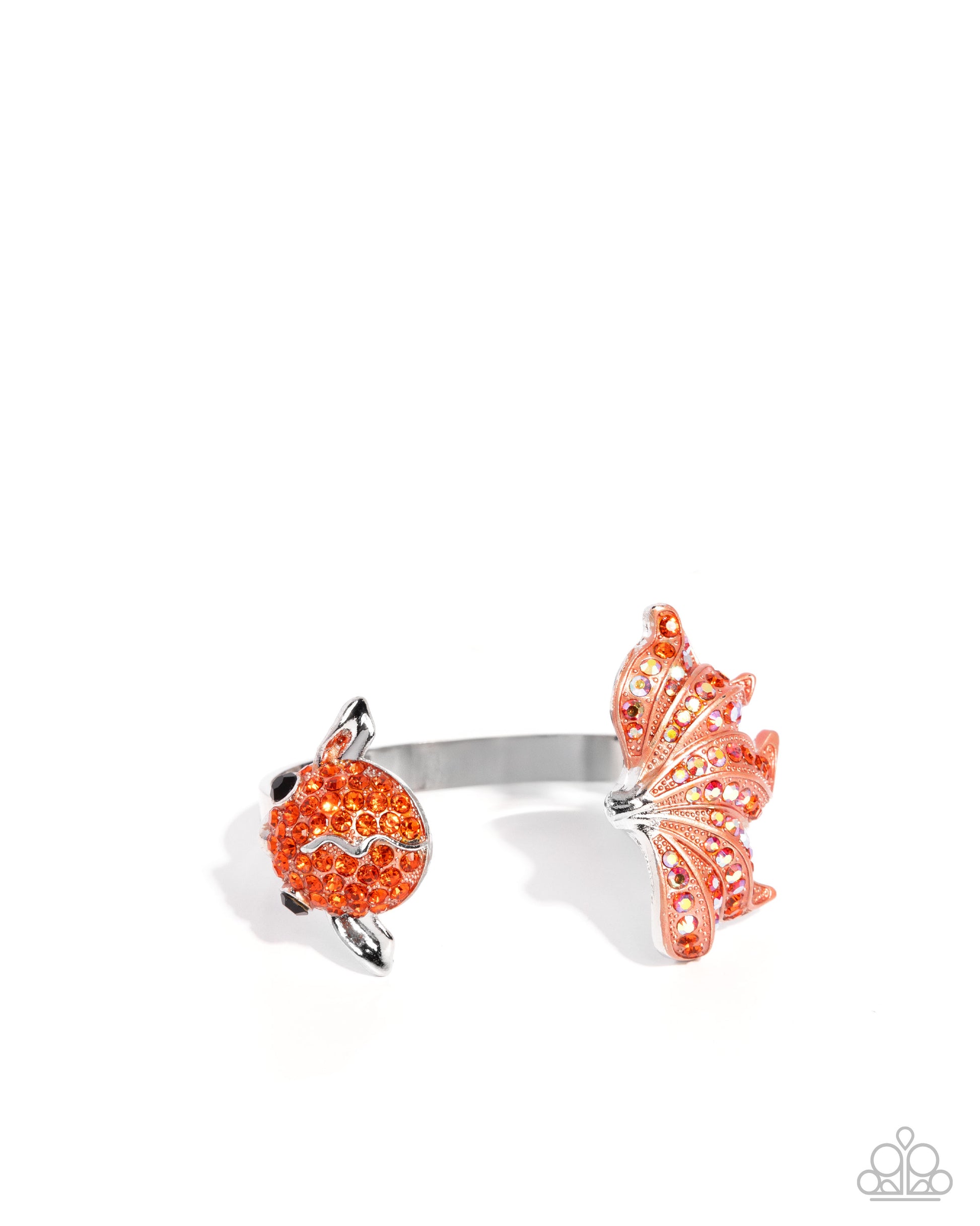 Silver ring with orange gemstones on a white background