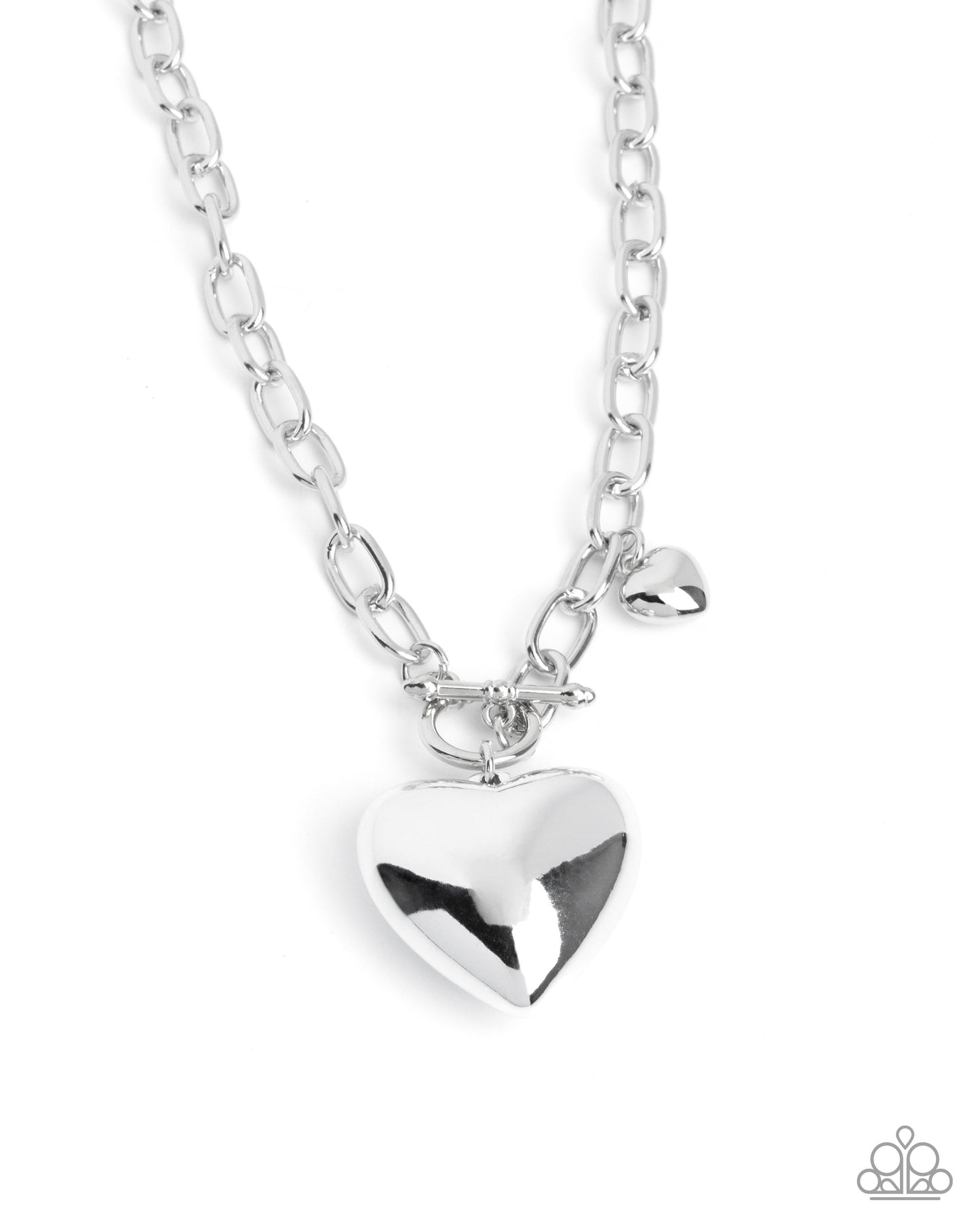 Silver heart-shaped pendant on a chain against a white background