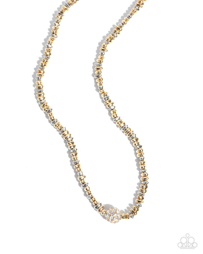 Necklace with gold and silver beads on a white background