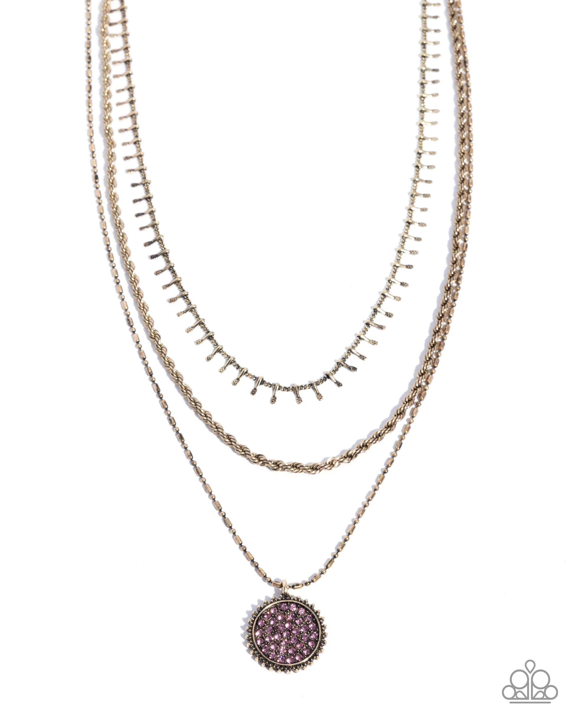 Layered gold necklaces with a purple pendant on a white background
