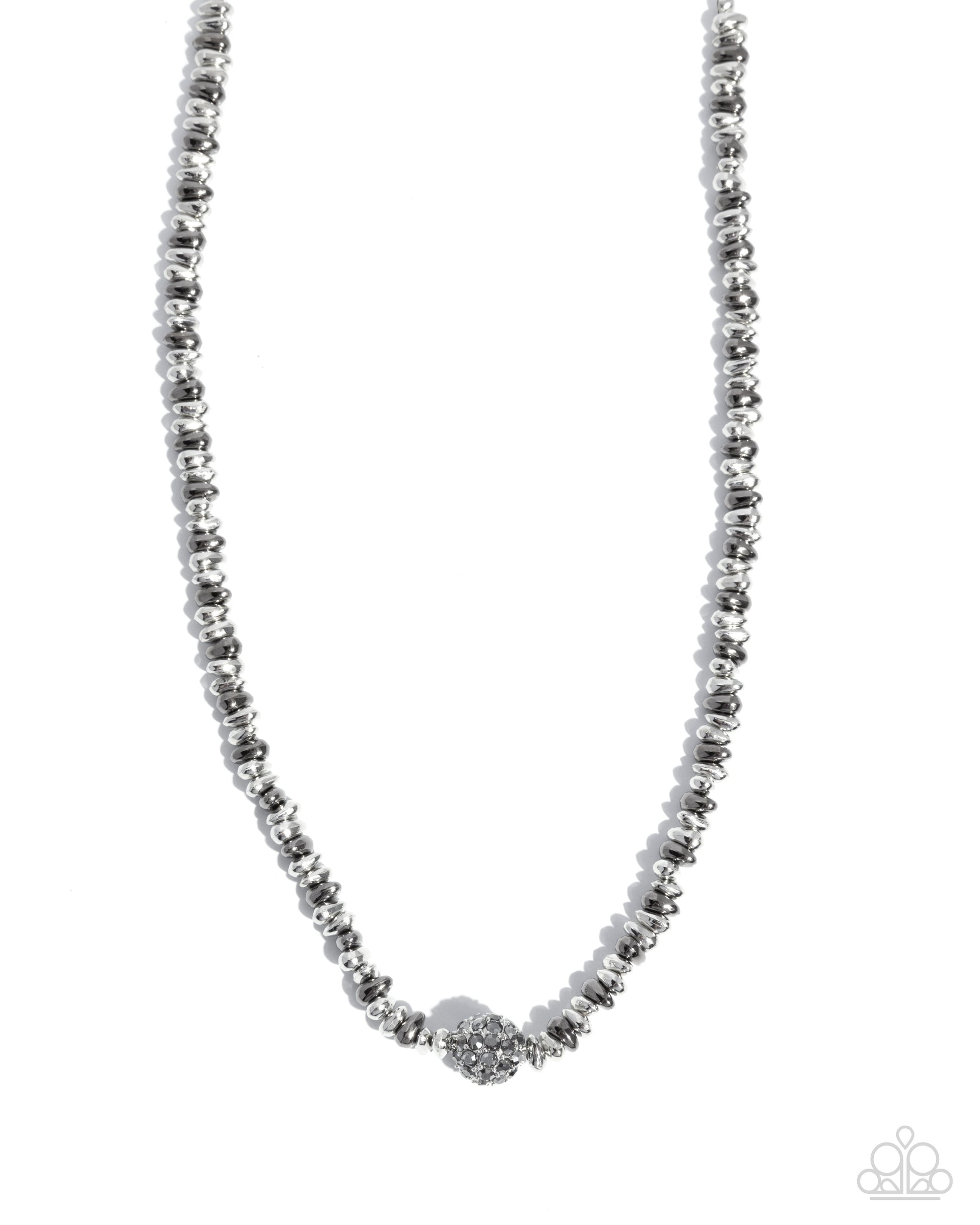 Silver beaded necklace on a white background
