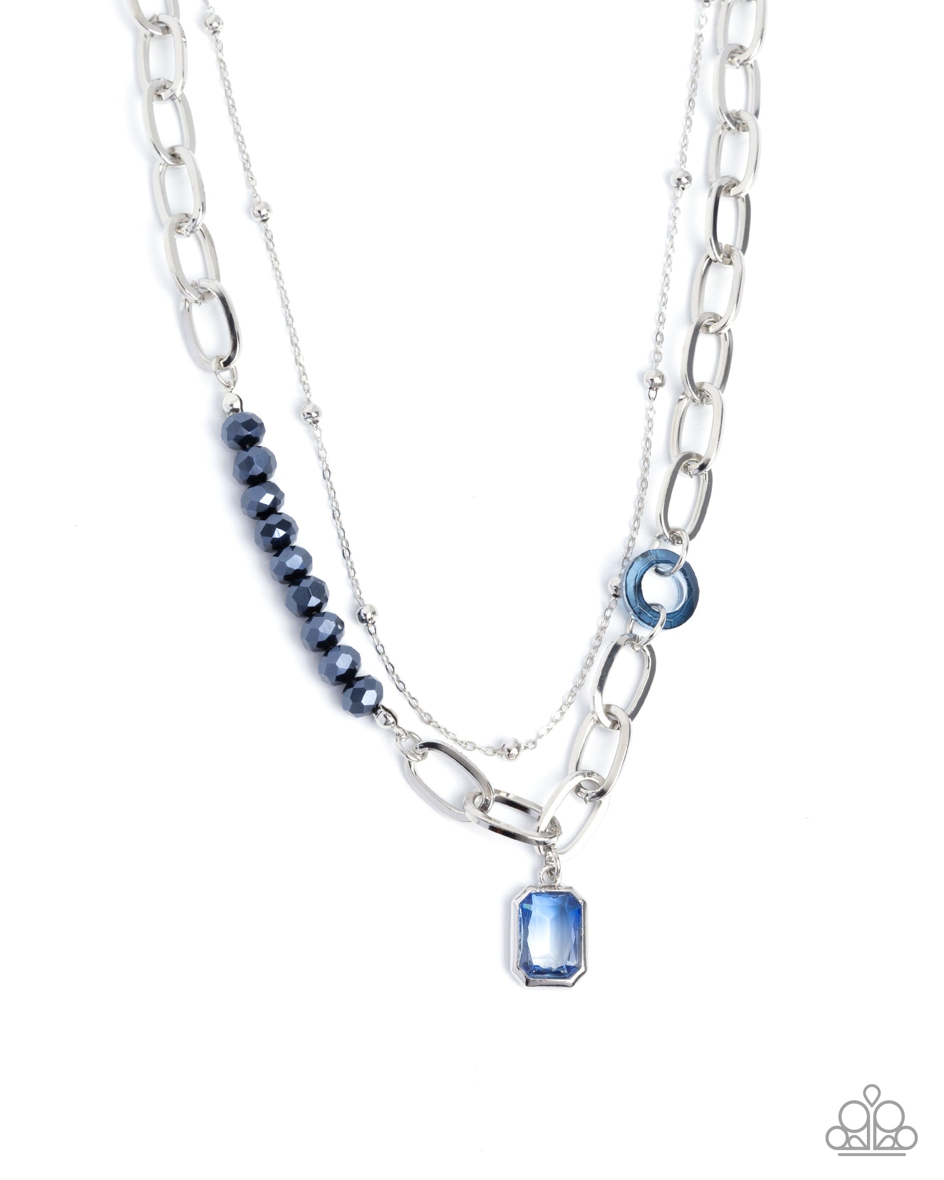 Layered silver and blue beaded necklace on a white background