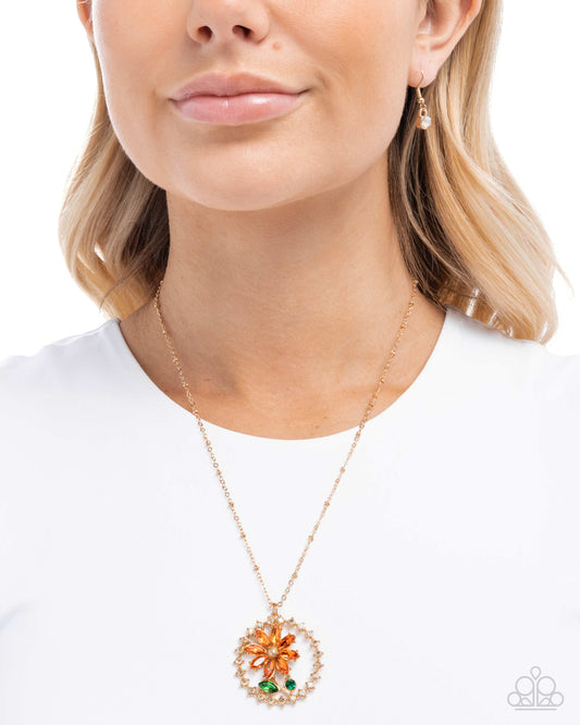 Necklace with a floral pendant worn by a model on a white background