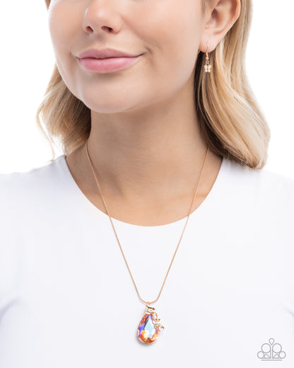 Necklace with a colorful pendant worn by a model on a white background