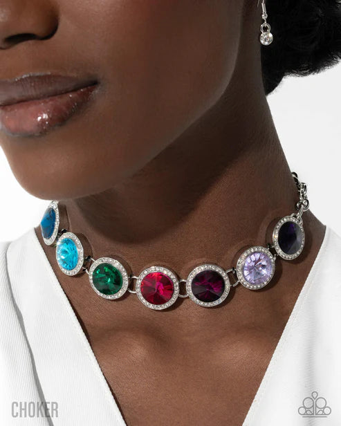 Close-up of a woman wearing a colorful choker necklace with a white background