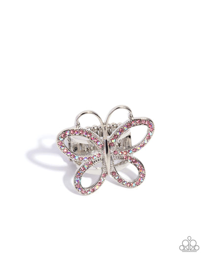 A butterfly-shaped ring set with pink and clear rhinestones on a silver-tone band, shown against a plain white background.