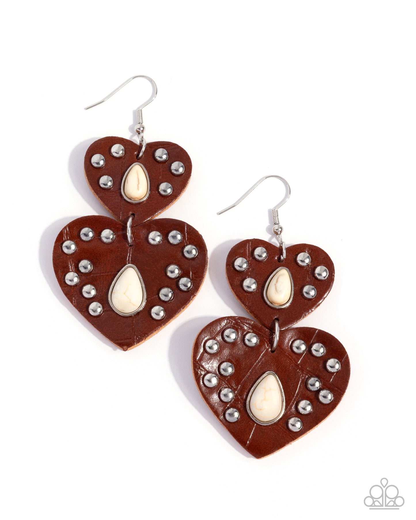 Heart-shaped earrings with brown leather, white stones, and silver studs on a white background