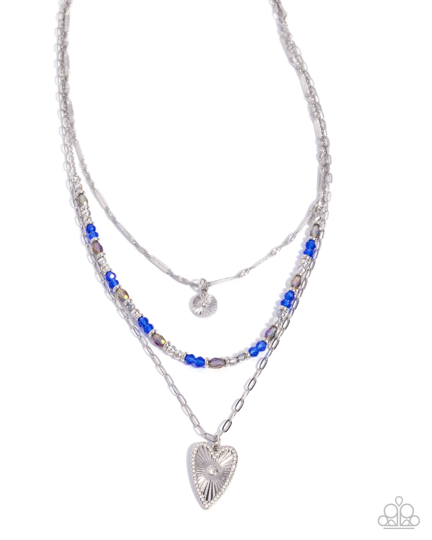 Stack of layered necklaces with heart pendant on a white background