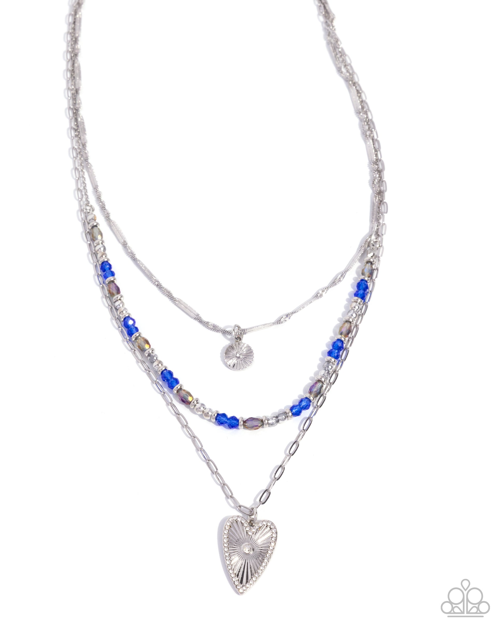 Stack of layered necklaces with heart pendant on a white background