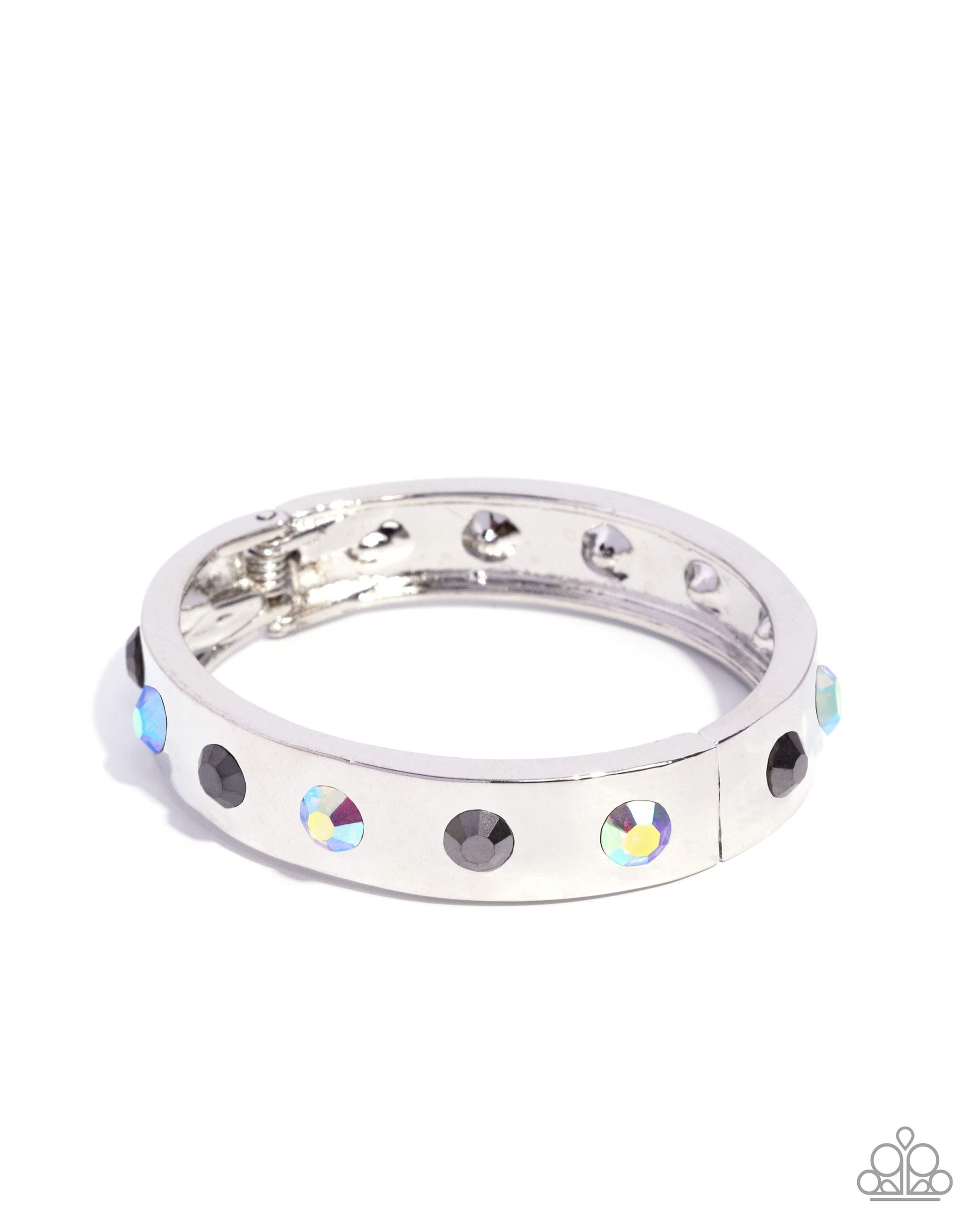 Silver ring with colorful gemstones on a white background