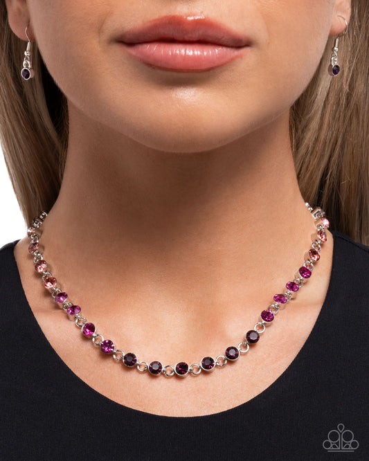 Necklace with pink and purple beads worn by a model on a white background