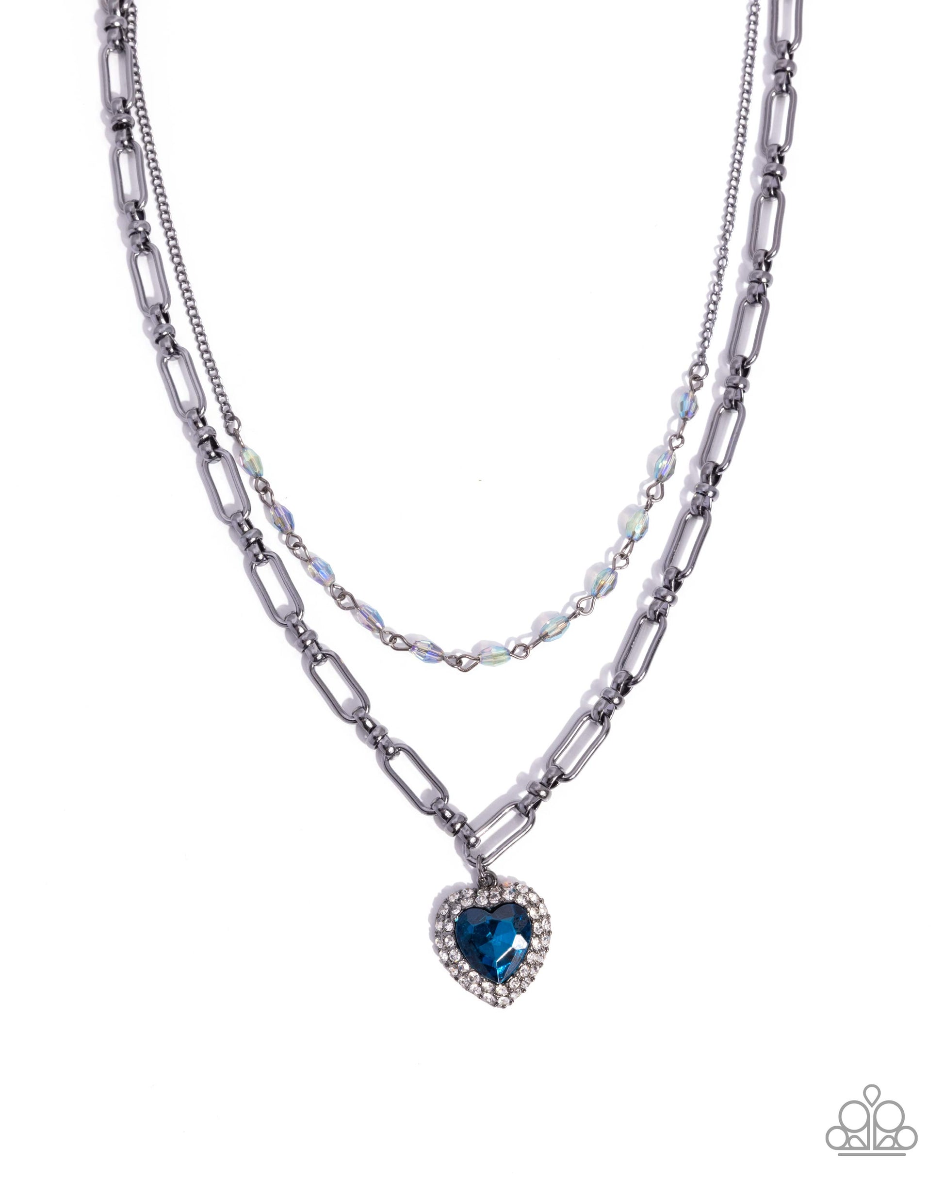 Two layered necklaces with a heart-shaped blue gemstone pendant on a white background