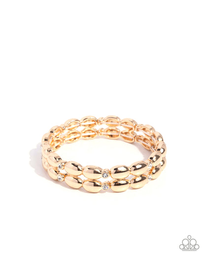 Gold chain-style bracelet on a white background
