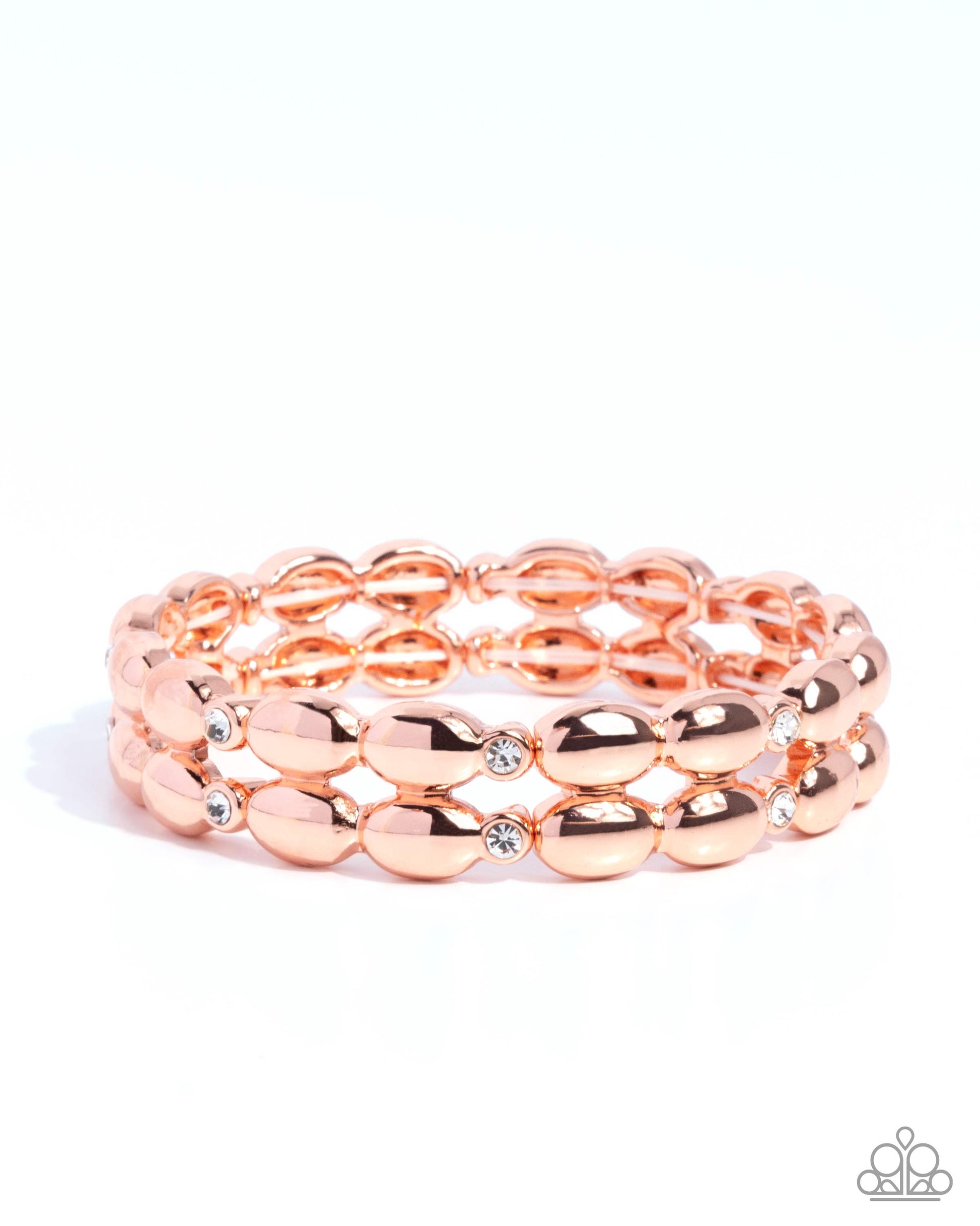 Rose gold beaded bracelet with a clear gemstone on a white background