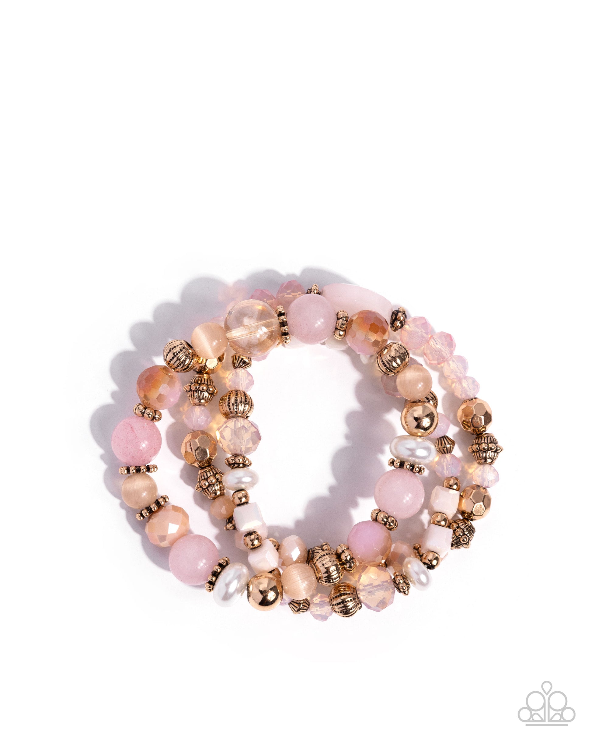 Set of beaded bracelets with pink, gold, and white beads on a white background