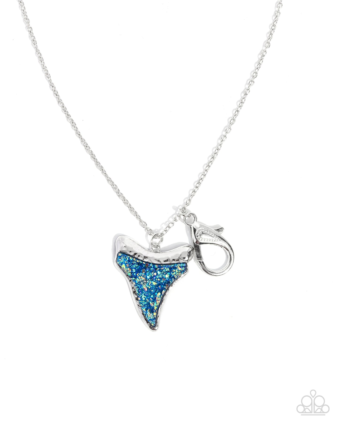 Silver necklace with a blue glittery shark tooth pendant on a white background
