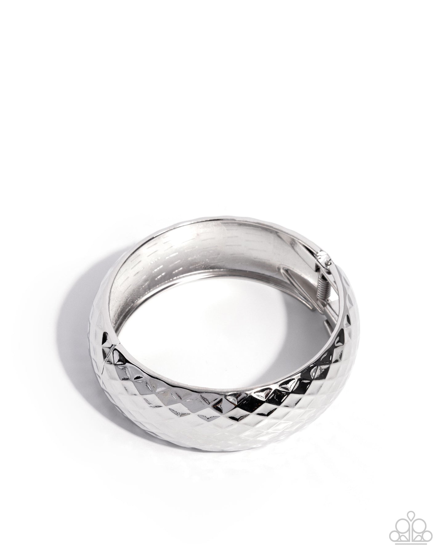Silver ring with textured design on a white background