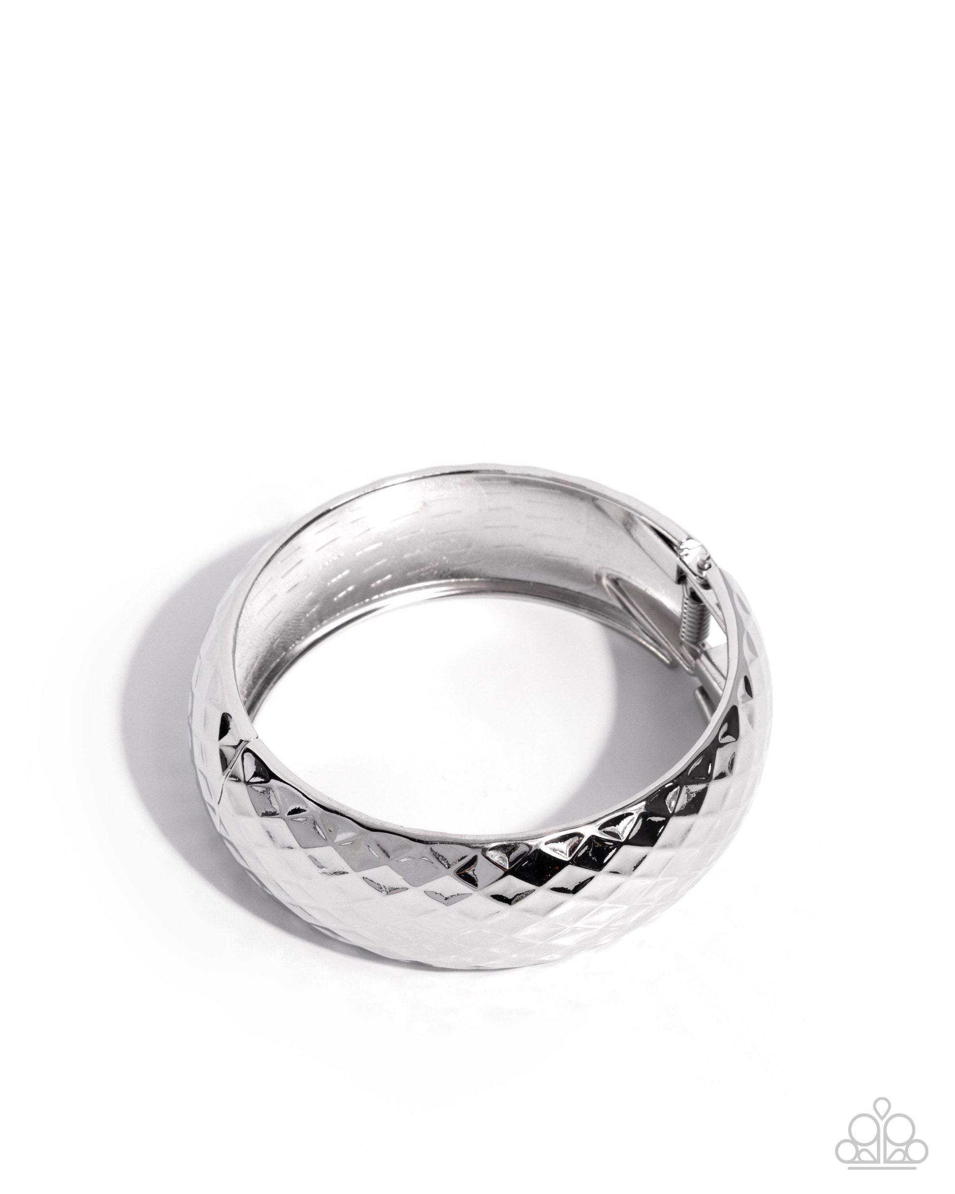 Silver ring with textured design on a white background