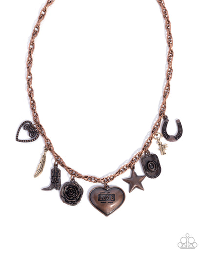 Necklace with various charms including a heart, star, and rose on a white background