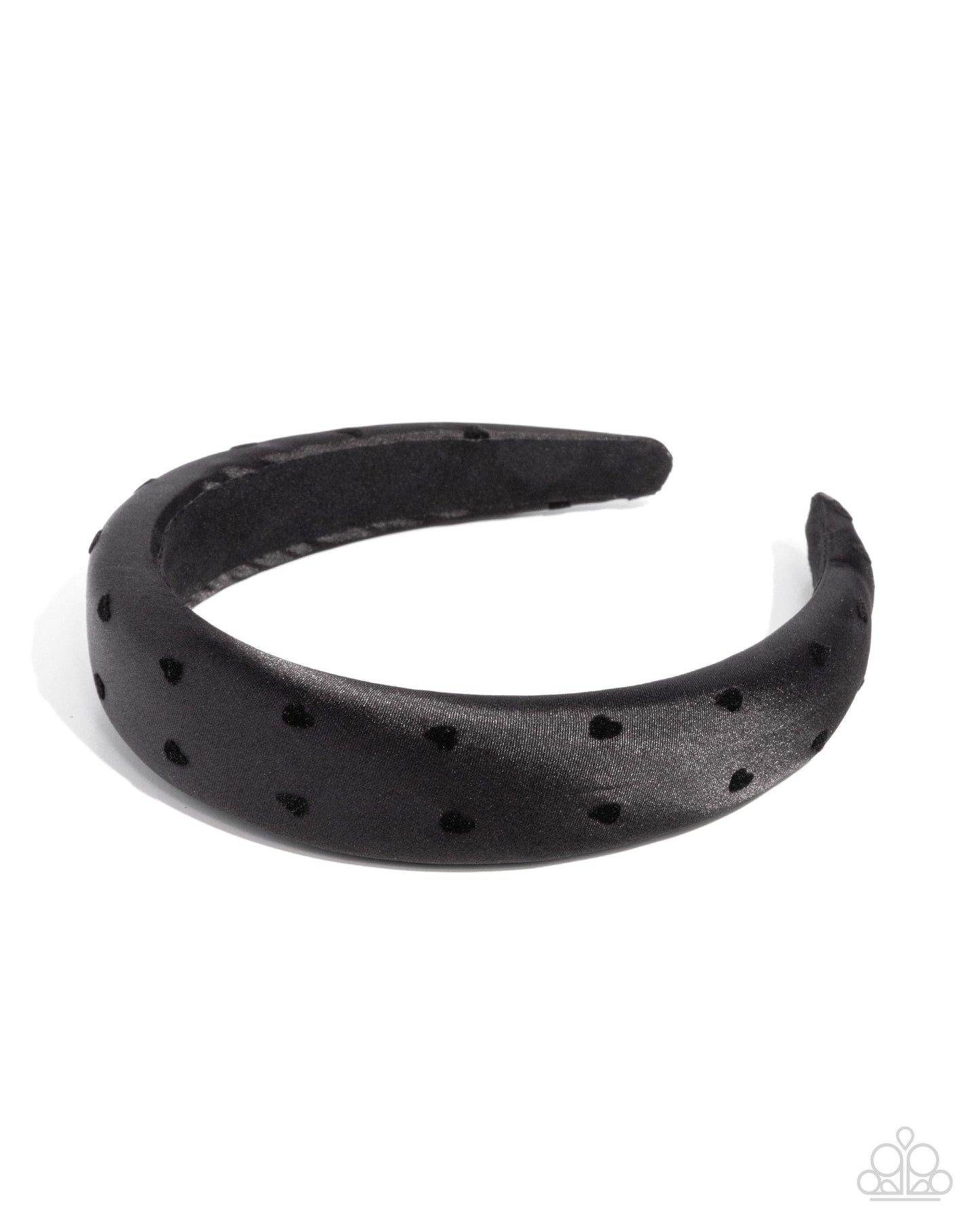 Black headband with cut-out design on a white background